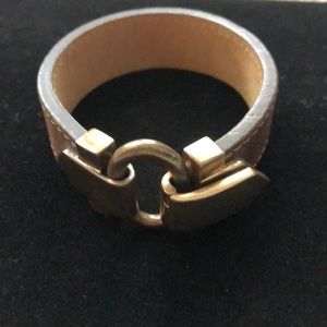 Brown leather bracelet with gold tone closure